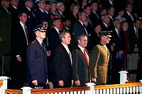 Secretary of Defense Donald Rumsfeld, President George W. Bush, Chairman of The Joint Chiefs of Staff General Richard B. Myers, and Vice Chairman of The Joint Chiefs of Staff General Peter Pace watch troops pass in review at Fort Myer, Virginia, on October 15, 2001.
