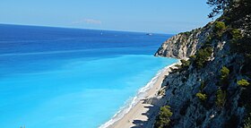 The Egremnoi sand beach in the Greek island of Lefkada, noted for its blue crystal waters, is a popular tourist destination. Egremni beach.JPG