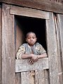 Enfant à la fenêtre, pays Zafimaniry, Madagascar (26005920581).jpg