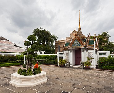 Buddhist monk resting in the Grand Palace, Bangkok, Thailand