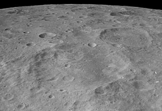 Oblique view of Guyot (center foreground) and Kostinskiy (right of center), from Apollo 16 Guyot crater AS16-M-1320.jpg