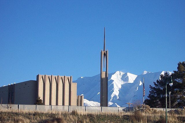 A meetinghouse of the Church of Jesus Christ of Latter-day Saints in Orem set against winter mountain backdrop