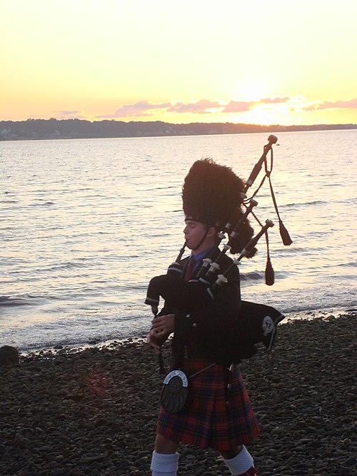 A piper playing the bagpipes in Newport, Rhode Island