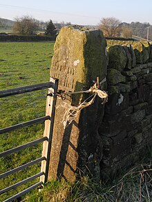 Long Causeway, milestone 5, now a field gatepost close to Wyming farm. Long Causeway Milesone 5.jpg