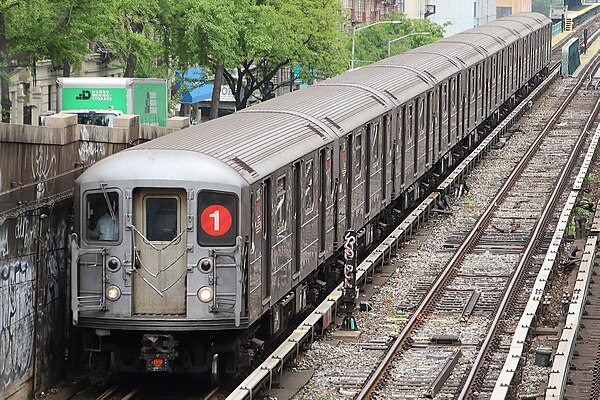 A 1 train in service departing 125th Street along part of the route of the Original Subway.