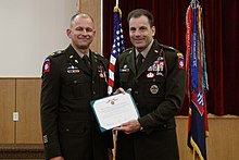 Donahue presents an award to Lt. Col. Brian Koyn for his religious leadership of the 82nd Airborne Division on June 8, 2021. Maj. Gen. Christopher T. Donahue Presented an Award to Lt. Col. Brian Koyn.jpg