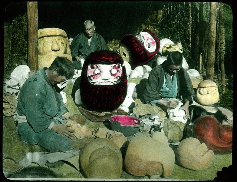 File:Men making clay moulds for giant masks. (19942519282).jpg