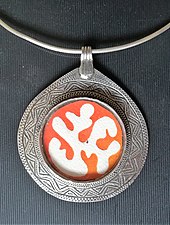 Silver pendant with traditional engraved ornaments in niello technique and contemporary application, modern side of a double-use piece Modern silver pendant by Moroccan designer Amina Agueznay.jpg