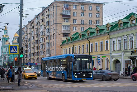 Mosgortrans bus in current blue transport livery on Spartakovskaya Street and Yelokhovo Cathedral on the foreground.