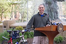 Providence, Rhode Island mayor Jorge Elorza addresses a Bike to Work day gathering in May 2015. Providence mayor Jorge Elorza with bicycle.jpg