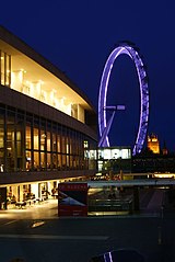 North-western facade at night with the London Eye and Palace of Westminster upriver, November 2009