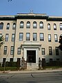 The main entrance of the former Saint Peter's School, located at 230 Gorham Street, Lowell, Massachusetts. West (front) and south sides of building shown.