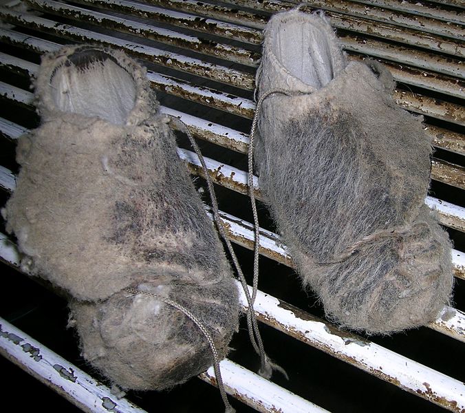 Shearers' moccasins on a wool rolling table.