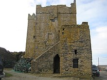 Another view of the castle, with many arrowslits. Slade Harbour Castle.jpg