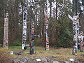 File:Stanley Park Totem Poles.JPG