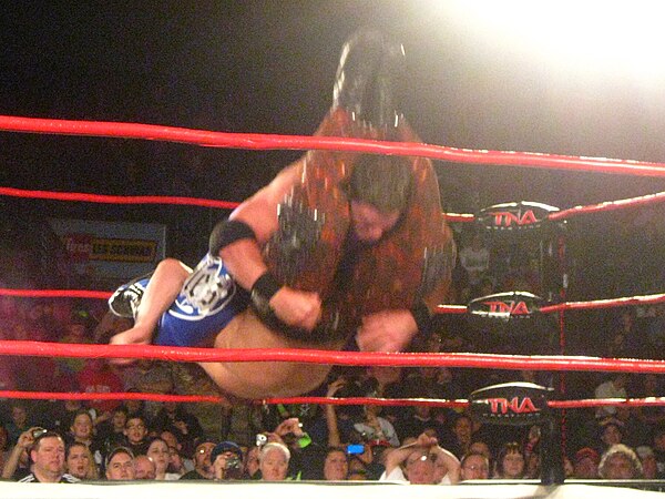 Styles performing the Styles Clash on Matt Hardy