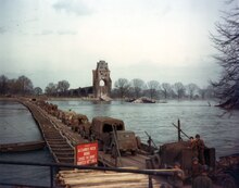 American forces cross the Alexander Patch bridge. US Army mechanized forces cross the Rhine River on the Alexander Patch Heavy Pontoon Bridge.tif