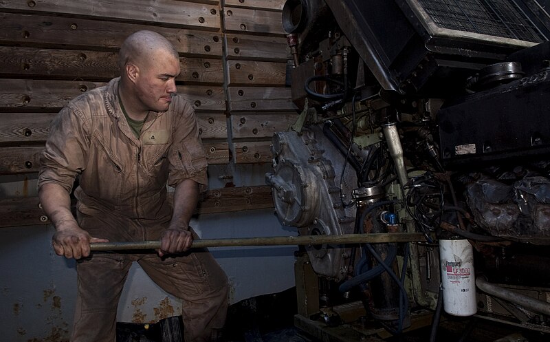 File:US Navy 110406-N-QP268-157 Lance Cpl. David Ahrens does maintenance on an amphibious assault vehicle (AAV) Cummins VTA 903 T 525 diesel engine aboa.jpg