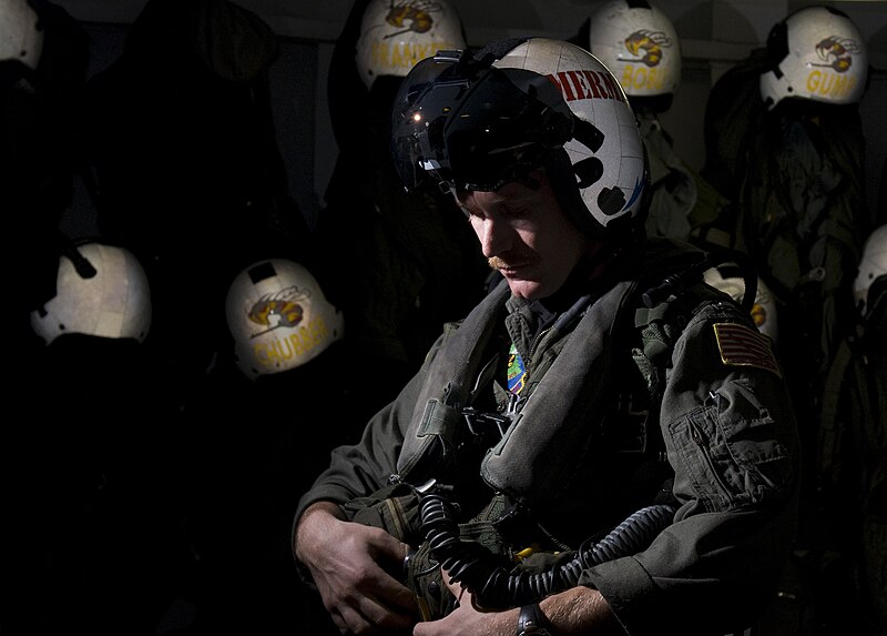 File:US Navy 111217-N-TZ605-051 Lt. Robert Blackwood, assigned to Strike Fighter Squadron (VFA) 113, puts on his flight suit in the squadron's paraloft.jpg