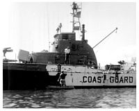 Point Gammon gets a camouflage coat of dark grey paint at Da Nang, October 1965, for its conversion from Coast Guard use to Vietnam War river patrol duties. VTN 82 Paint.jpg