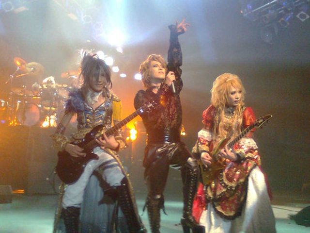 Versailles performing in 2010, wearing costumes inspired by the French Rococo style