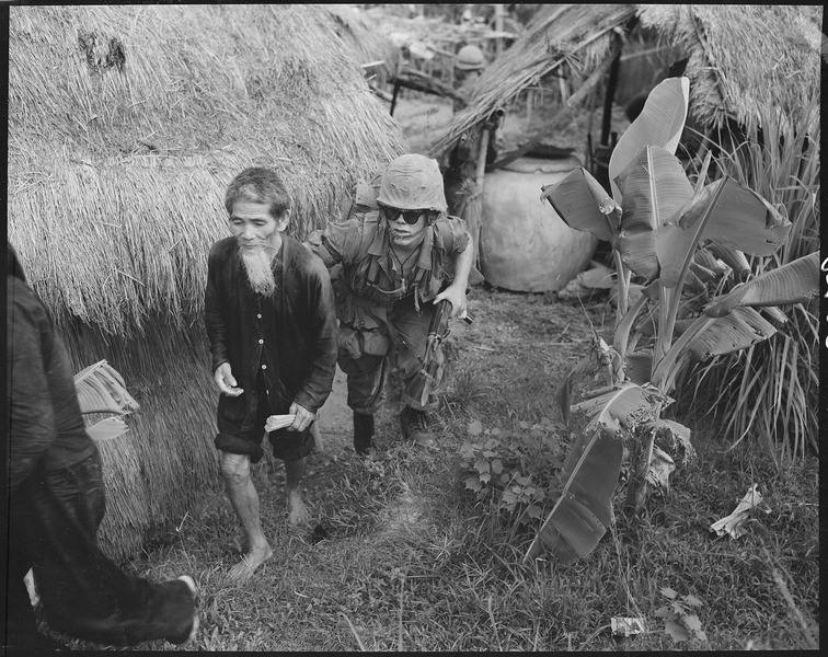 File:Vietnam....A Marine from 1st Battalion, 3rd Marines, moves a Viet Cong suspect to the rear during a search and clear... - NARA - 532431.tif