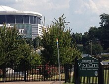 Vine City sign with Georgia Dome in background Vine City sign with Georgia Dome in background.JPG