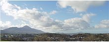 Panoramic view of Westport as seen from the Castlebar side, showing Croagh Patrick (left background) and Clare Island (right background)