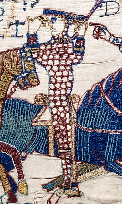 William is depicted in the Bayeux Tapestry during the Battle of Hastings, lifting his helmet to show that he is still alive.