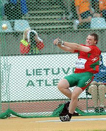 Yury Shayunou spinning with the hammer within the circle in hammer throw Yury Shayunou.JPG