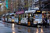 A pair of southbound Melbourne trams embark passengers in Swanston Street just north of Little Collins Street in May 2012