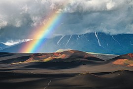 Rainbow over volcanic cones, Kamchatka Krai, Russia