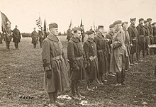 Major General Hanson Edward Ely, commanding the 5th Division, pinning the Distinguished Service Cross on Captain Howard R. MacAdams of the 5th Division's 7th Engineer Regiment, Esch, Luxembourg, December 30, 1918. 111-SC-44590 - NARA - 55247947-cropped.jpg