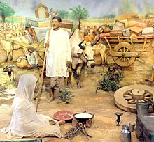 The photo monument depicting a couple migrating from India to Pakistan with their household stuff and cattle during the Partition of India. A couple migrating from India To Pakistan with their household stuff and cattle during Partition.JPG