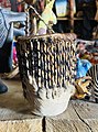 A drum made from animal skin and wood