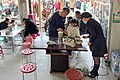 A family ready for breakfast at a restaurant in Chengjiang, Yunnan (20240222095201)