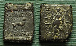 Indian coinage of Agathocles.Obv Lion with Greek legend: ΒΑΣΙΛΕΩΣ ΑΓΑΘΟΚΛΕΟΥΣ.Rev Lakshmi, with Brahmi legend Rajane Agathukleyasa "King Agathocles".