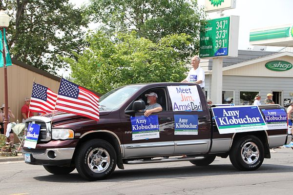 Klobuchar's father, Jim, and supporters campaigning for Klobuchar as U.S. senator, Tower, Minnesota, July 4, 2012