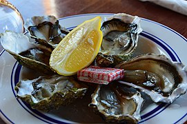 Day 20: Oysters on a plate with lemon and a butter