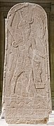 Stèle du dieu Baal brandissant le foudre, Ugarit, XVe – XIIIe siècles av. J.-C. Musée du Louvre.