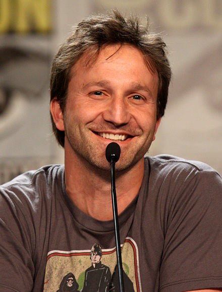 Breckin Meyer portrays Jon Arbuckle in the feature film adaptations.