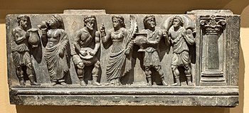 Revelers in Greek dress. Cleveland Museum of Art. Buner reliefs Greek bacchanalian cropped.jpg