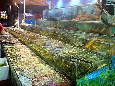 Due to Guangdong's location on the southern coast of China, fresh live seafood is a specialty in Cantonese cuisine. Such markets selling seafood are found across East Asia.
