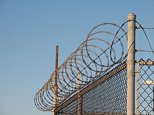 Concertina wire on the FAA airplane station.jpg