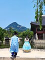 Couple waring traditional Korean costumes in Gyeongbokgung,the Seoul palace 05
