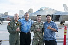 David Apatang stands with Airmen visiting the Northern Marianas David Apatang Standing with USAF Airmen.jpg