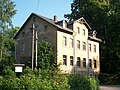 Former restaurant of a paper mill with an outbuilding