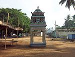 A close view of a small open-sided temple