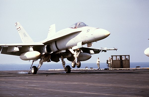 A VMFA-314 F/A-18A lands on USS Coral Sea