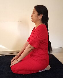Full Flexion knees by sitting on lower legs.